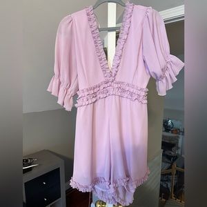 Boutique lavender romper with back out